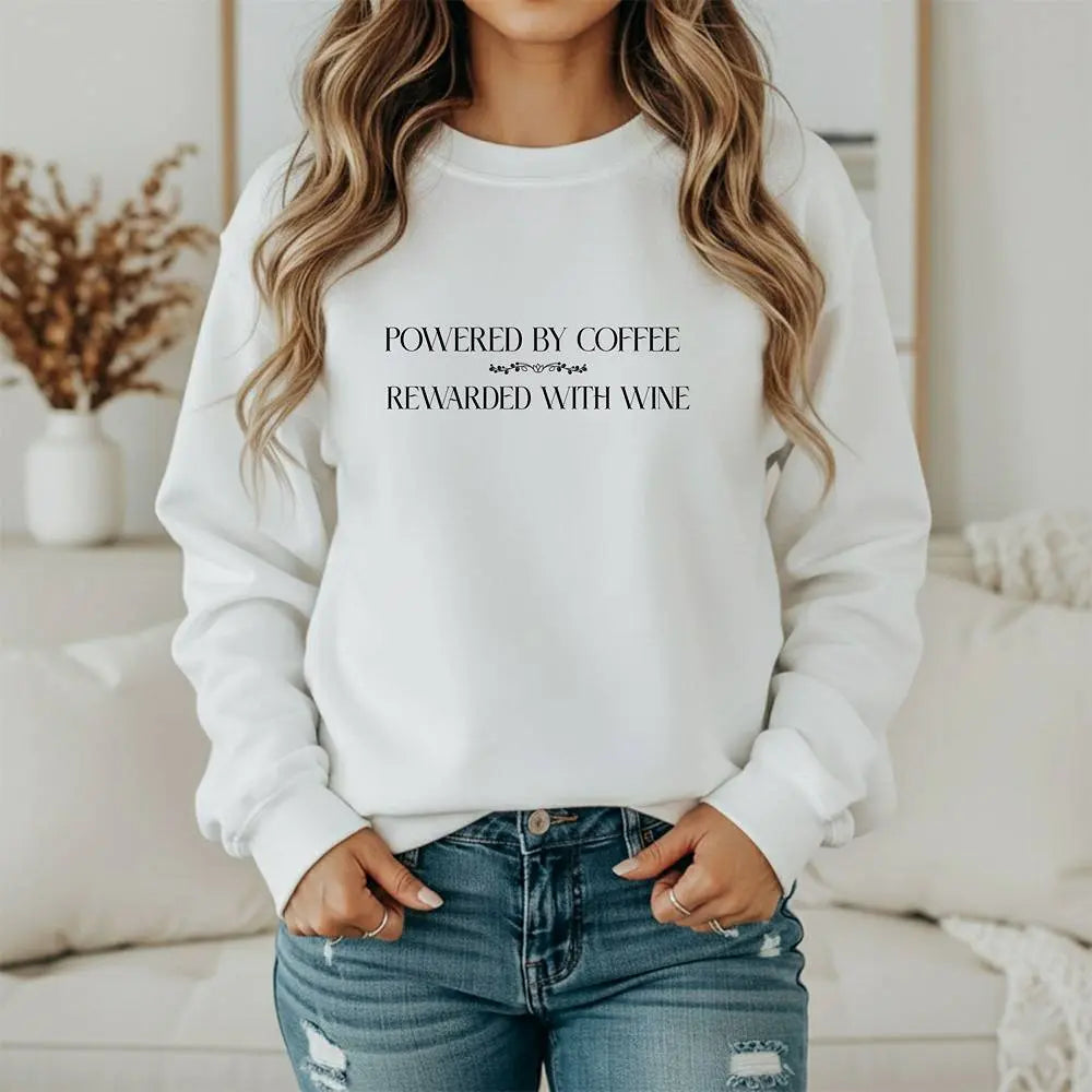 "Powered by Coffee, Rewarded with Wine" Crewneck Sweatshirt — Cozy Casual Coffee & Wine Lover Pullover Printify