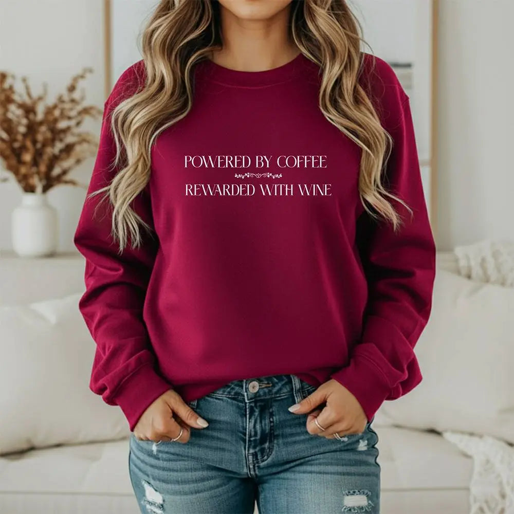 "Powered by Coffee, Rewarded with Wine" Crewneck Sweatshirt — Cozy Casual Coffee & Wine Lover Pullover Printify