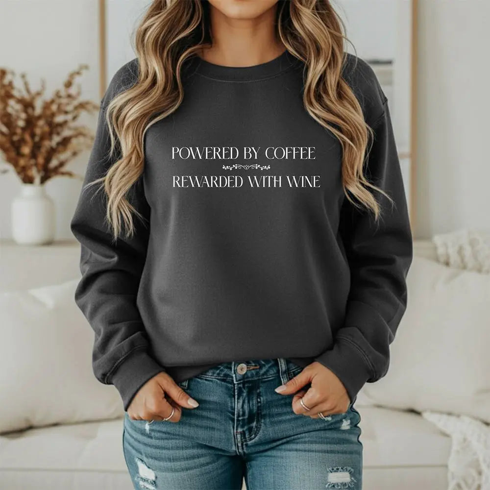 "Powered by Coffee, Rewarded with Wine" Crewneck Sweatshirt — Cozy Casual Coffee & Wine Lover Pullover Printify