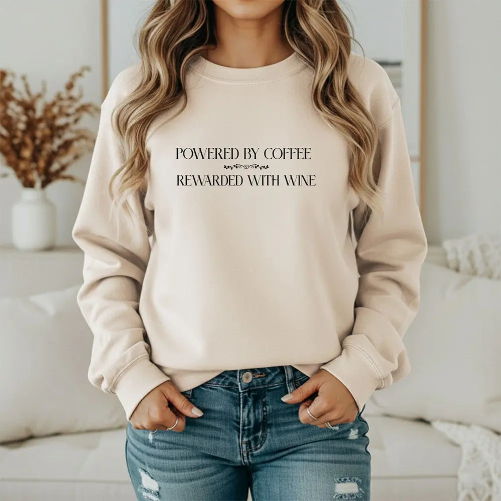 "Powered by Coffee, Rewarded with Wine" Crewneck Sweatshirt — Cozy Casual Coffee & Wine Lover Pullover Printify