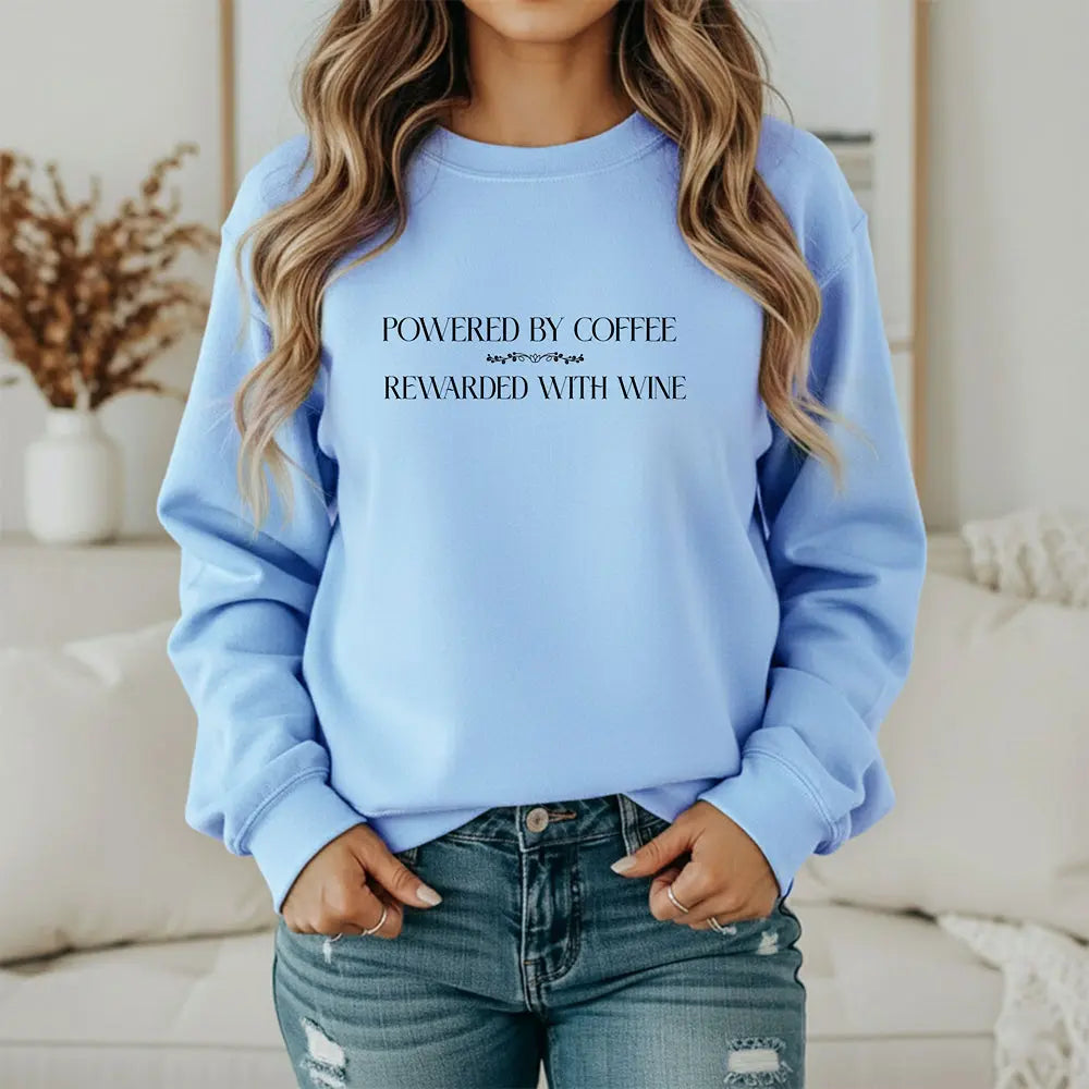 "Powered by Coffee, Rewarded with Wine" Crewneck Sweatshirt — Cozy Casual Coffee & Wine Lover Pullover Printify