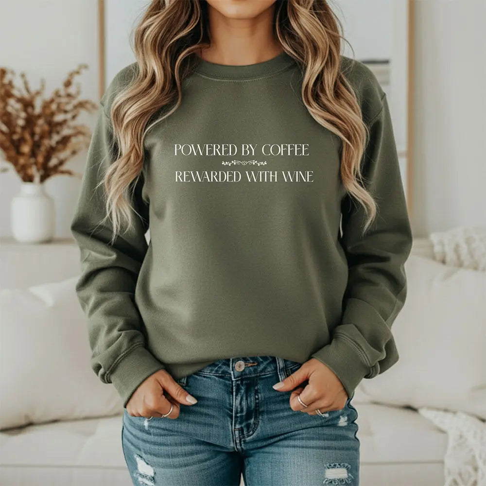"Powered by Coffee, Rewarded with Wine" Crewneck Sweatshirt — Cozy Casual Coffee & Wine Lover Pullover Printify