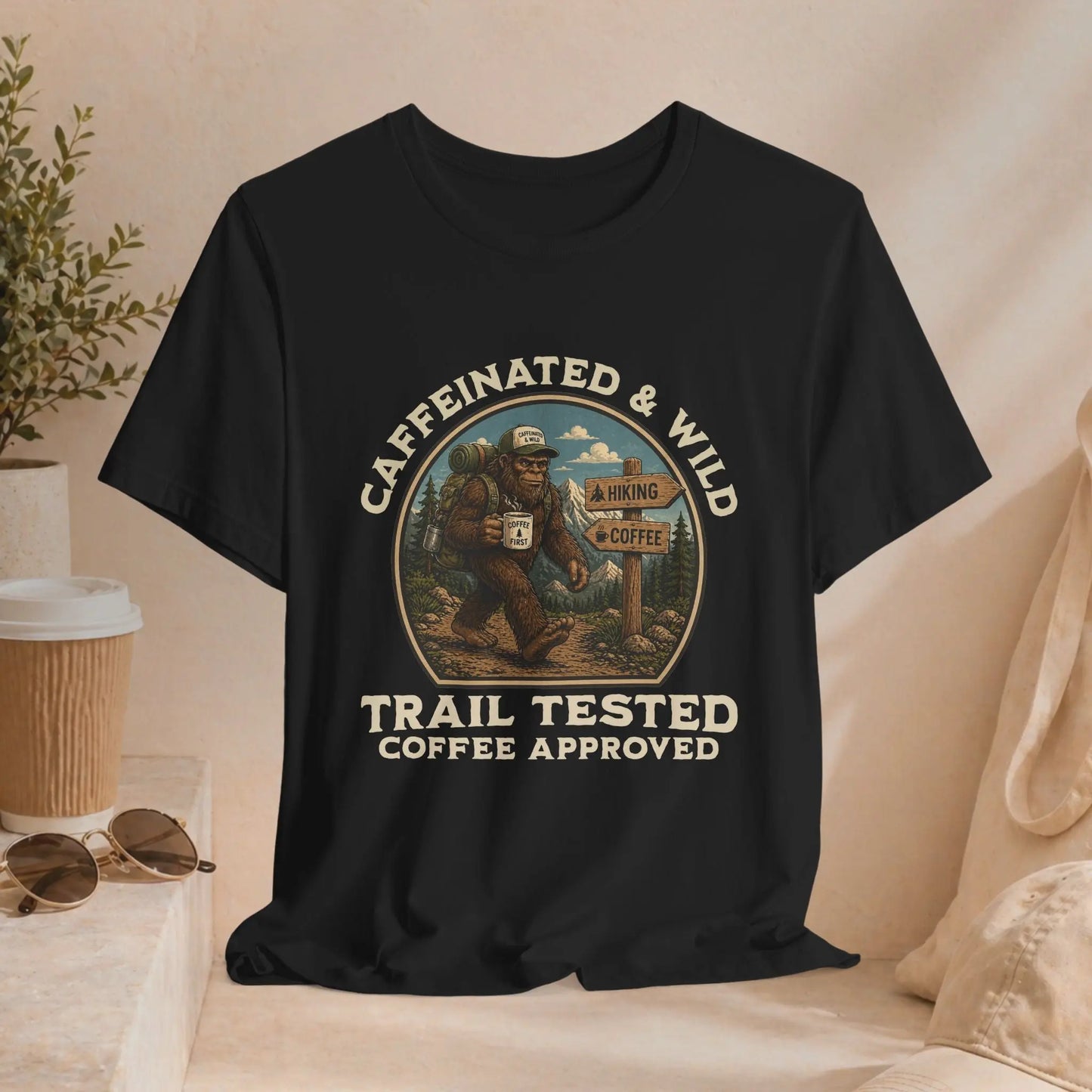 Caffeinated & Wild Tee — "Trail Tested Coffee Approved" Big Foot, Coffee, and Outdoor Hiking T-Shirt Printify